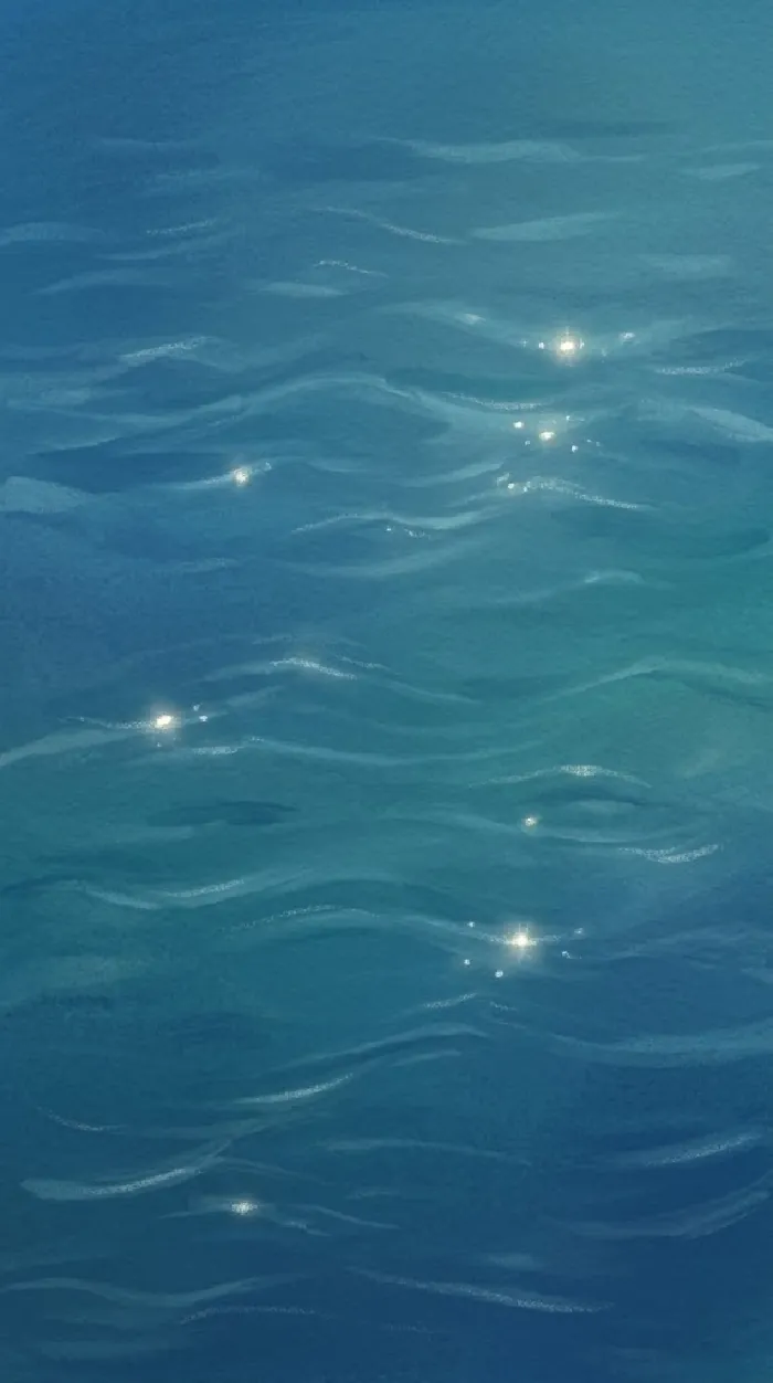 Painted blue sea seen from above.